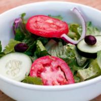 House Salad · Served with Romaine hearts, tomato, cucumber, red onion, olive and choice of dressings