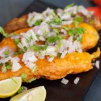 Mirchi Bajji · With masala. A spicy chili pepper dipped in chickpea batter and deep fried, served with stuf...