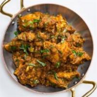 Bhuna Chicken · Chicken cooked in special pepper house masala, comes semi dry.