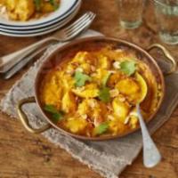Chicken Korma · Tender pieces of chicken cooked in a rich nutty gravy based out of fresh coconut along with ...