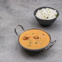 Chicken Butter Masala · Tender chicken cooked in a silky tomato gravy with cream and spices.