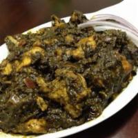 Gongura Chicken · Chicken and red sorrel leaves simmered in onion, tomatoes and exotic spices.