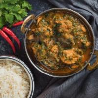 Saag Chicken · Spinach cooked with chicken pieces in a mildly spiced onion and tomato sauce.