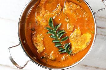 Fish Pulusu · Fish fillets simmered in onion, tomato, tamarind gravy, fenugreek seeds, curry leaves and exotic spices.