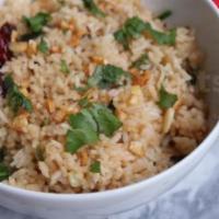 Ginger Garlic Fried Rice · Steamed rice stir fried in a work with vegetables, ginger, garlic and with your choice of pr...