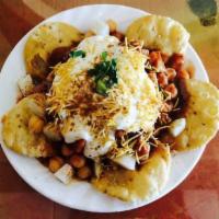 Papri Chat · Crispy wheat flour tortillas mixed with potatoes, chickpeas, topped with yogurt, tamarind an...