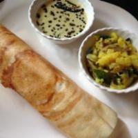 Masala Dosa · Dosa filled with mildly spiced mashed potatoes and onions. Thin crepe made with fermented ri...