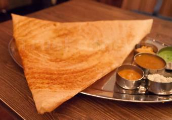 Mysore Masala Dosa · Spicy sauce smeared dosa filled with mildly spiced mashed potatoes and onions. Thin crepe made with fermented rice and lentil batter.