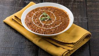 Dal Makhani · Black lentils and red kidney beans cooked in a creamy sauce and seasoned with garlic.