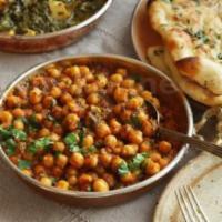 Chana Masala · Chickpeas simmered in onion and tomatoes gravy with exotic spices.