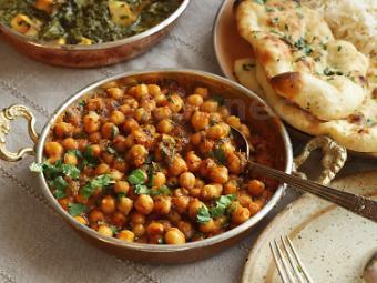 Chana Masala · Chickpeas simmered in onion and tomatoes gravy with exotic spices.