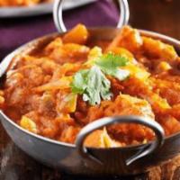 Vegetable Vindaloo · Fresh vegetables and potatoes simmered in a delicious blend of red chilies, ginger, garlic a...