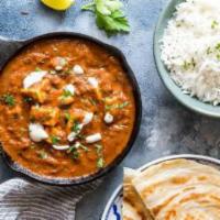 Paneer Butter Masala · Indian cottage cheese cubes cooked in a silky tomato gravy with cream and spices.