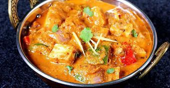 Kadai Paneer · Indian cottage cheese cubes and bell peppers simmered in a gravy of onions and tomatoes.