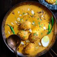 Egg Korma · Hard boiled eggs simmered in a sauce made with exotic spices, cashew paste and yogurt.