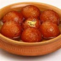Gulab Jamun · Deep fried milk and flour based spongy balls soaked in cardamom sugar syrup.