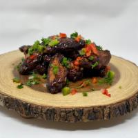 BBQ Jerk Wings · 8 Crispy and gently cooked wings covered in our homemade Bbq Jerk sauce