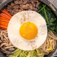 Bibimpap · Served with egg , rice, vegetables, gochujang sauce.