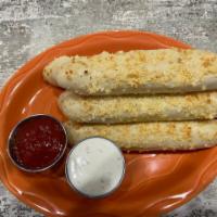 Breadsticks · Large soft sticks coated in garlic butter and lightly dusted with Parmesan cheese. Served wi...