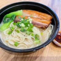 Pork Noodle Soup · Noodles in tonkotsu inspired pork bone broth, topped with braised pork belly and fresh bok c...