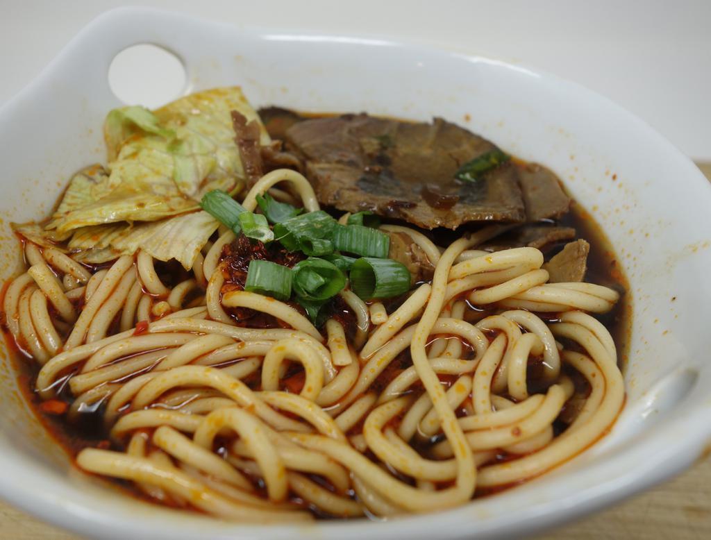 Beef Noodle Soup 牛汤面 · Chinese noodle in special house made Beef Broth.  Topped with slice braised beef and veggie. Little spicy.