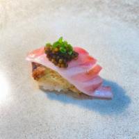 Kani Toro Caviar · Live dungeness crab topped with chutoro and kaluga caviar.