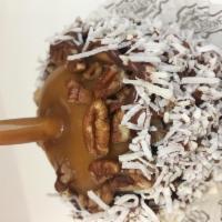 German Chocolate Caramel Apple · Granny smith apple dipped in chewy caramel the rolled in chopped pecans, drizzled with milk ...