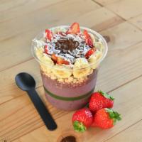 Coconutella Bowl · Acai base topped with granola, banana, strawberry, Nutella and coconut flakes. 