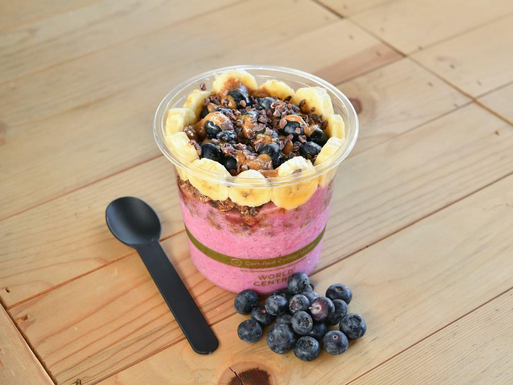 My Madness Bowl ·  Pitaya base topped with granola, banana, blueberry, almond butter, and cacao nibs.