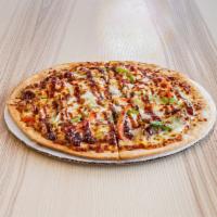 Pepper Steak Pizza · Beef, green pepper, red pepper, sweet onion, mozzarella cheese with Kung Pao sauce.
