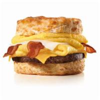 Monster Biscuit · Crispy bacon, sausage patty, two folded eggs, Swiss & American cheeses on a buttermilk biscu...