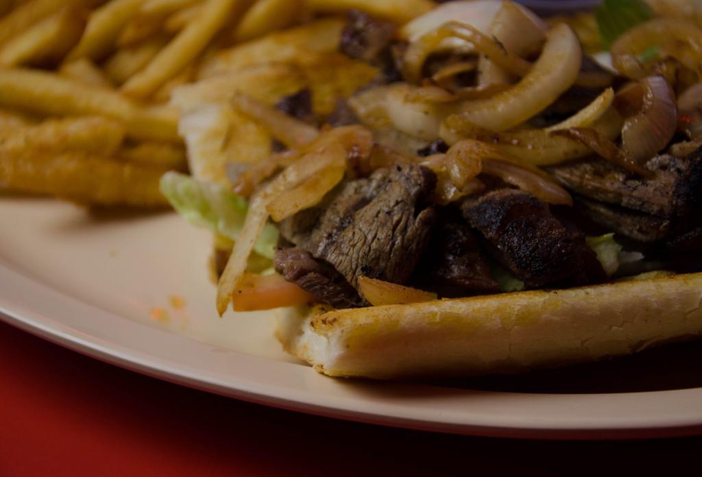 5. Skirt Steak Sandwich · Skirt Steak charbroiled to perfection, Served on French Bread topped  with Grilled Onions, Lettuce, Tomato, Mayonnaise, A1 Steak Sauce, includes fries and drink.