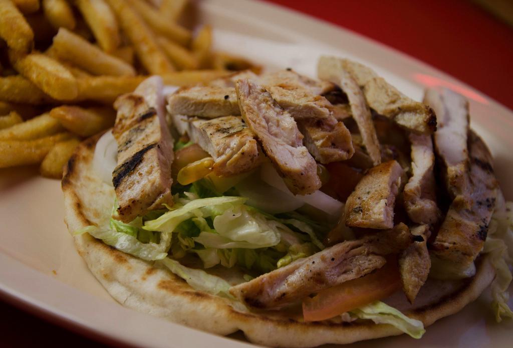 10. Chicken Pita · Fresh Grilled Chicken Breast topped with lettuce, tomato, mayo, and honey mustard, served on a pita, includes fries and drink.