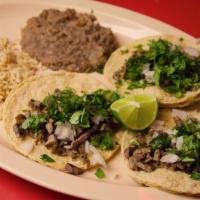 15. Taco Dinner · 3 Tacos with your choice of meat (Steak, Ground Beef, Chicken, Fish) served with Rice and Be...