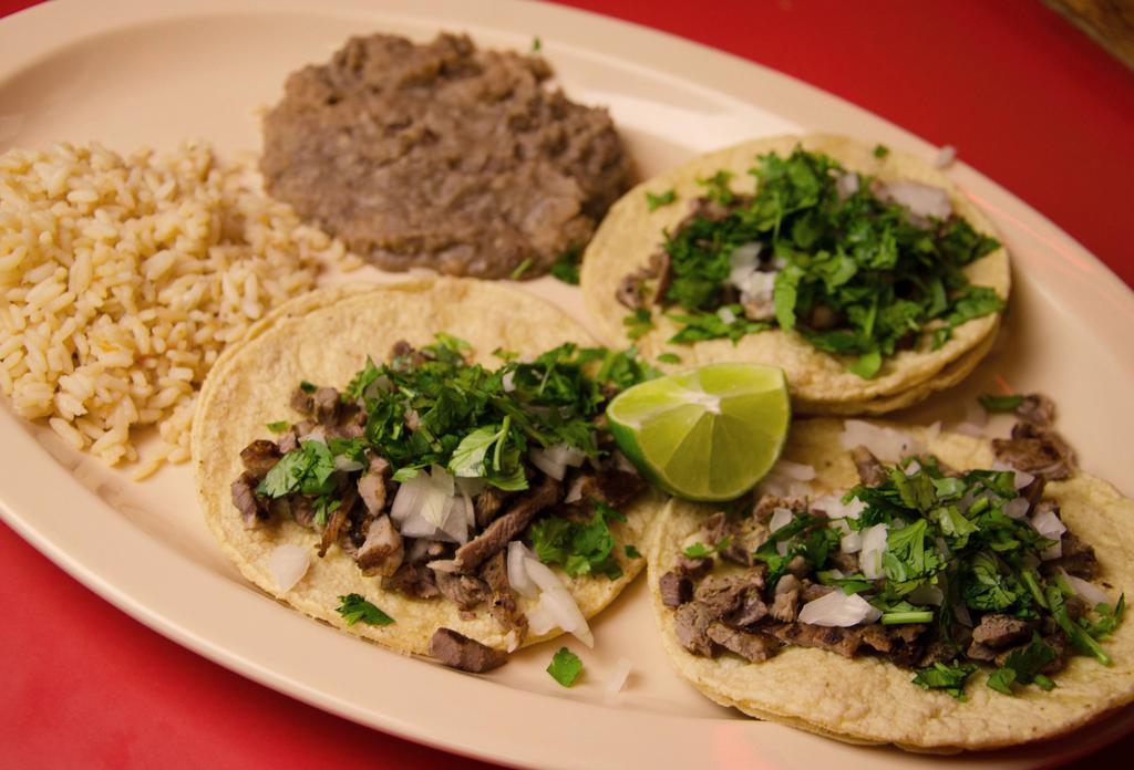 15. Taco Dinner · 3 Tacos with your choice of meat (Steak, Ground Beef, Chicken, Fish) served with Rice and Beans, includes Drink.
 ***Steak tacos topped with cilantro and onion, Chicken, ground beef, and Fish tacos topped with Lettuce and Tomato***