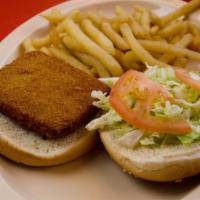 20. Fish Sandwich · Fish Fillet Sandwich topped with lettuce, tomato, mayo, and tartar sauce, served on a toaste...