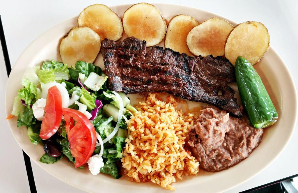 22. Carne Tampiqueña (Steak Dinner) · Skirt Steak Dinner served with rice, beans, side salad, a grilled jalapeño, and fresh fried potato chips, and tortillas, includes drink.