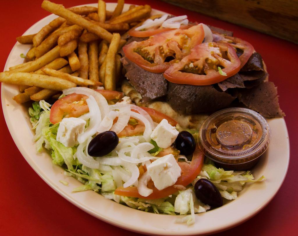 Gyros Dinner with Pita Bread · Our authentic Gyros meat on a hot pita bread, topped with onions, tomato, and tzatziki sauce, served with fries, and a salad, drink included.