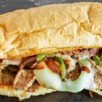 Philly Born and Raised · Thinly sliced top sirloin, smothered with melted provolone cheese, red onions and green pepp...