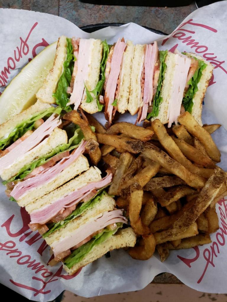 Sam’s Club · Ham and turkey, sliced thin with bacon, Swiss cheese, lettuce, tomato and mayo on your choice of toasted bread. Served with a pickle and your choice of side.