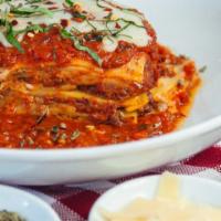 Beef Lasagna · House made layered lasagna with Angus beef Bolognese, Parmesan, Asiago, ricotta and mozzarel...
