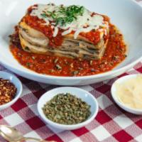 Eggplant Parmesan · Thick slices of breaded eggplant, layered with 4 cheeses, and house made pomodoro sauce