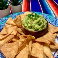 Guacamole and Chips · Fresh guacamole with freshly fried in house tortilla chips.