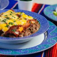 Enchilada Plate · Enchilada plate with a flour tortilla, Mexican rice, pinto beans, sprinkle of cheese, choppe...