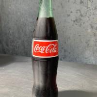 Mexican Coke · Mexican Coke in a glass bottle, made with pure cane sugar.