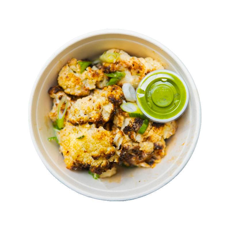 Cheesy Cauliflower with Pesto · Roasted cauliflower, lemon, parmesan, garlic chives, chili flakes with pesto on the side. Contains milk, soy.