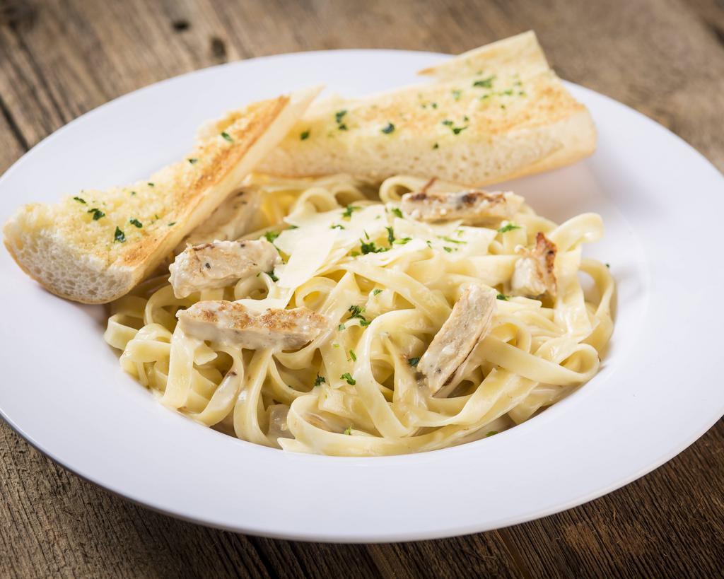 Fettuccine Alfredo with Grilled Chicken Pasta · Fettuccine noodles and tender grilled chicken tossed in a rich, creamy Alfredo sauce made with Asiago and Romano cheeses with a hint of garlic and fresh parsley.