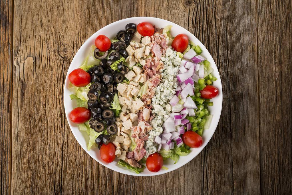 Chopped Salad · Finely chopped romaine and iceberg lettuce, spinach leaves, grilled chicken, green pepper, red onion, black olives, bacon, grape tomatoes, and bleu cheese crumbles.
