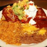 Deluxe Chimichanga Dinner · Includes enchilada style, guacamole, sour cream, beans, and rice.