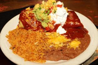 Deluxe Chimichanga Dinner · Includes enchilada style, guacamole, sour cream, beans, and rice.